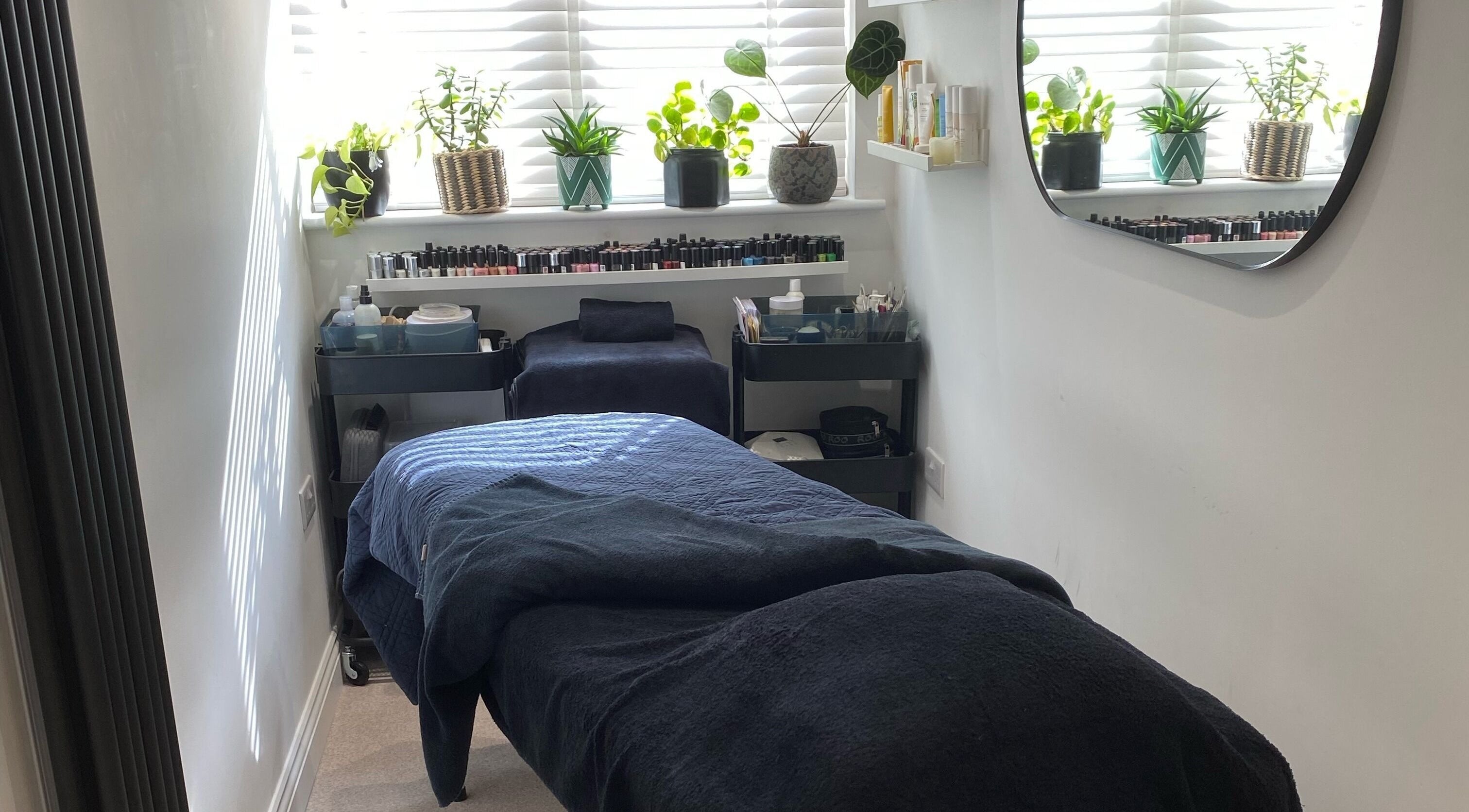 Peaceful treatment room at Rare Beauty by Adele, Farsley, England, GB with serene decor and plants.