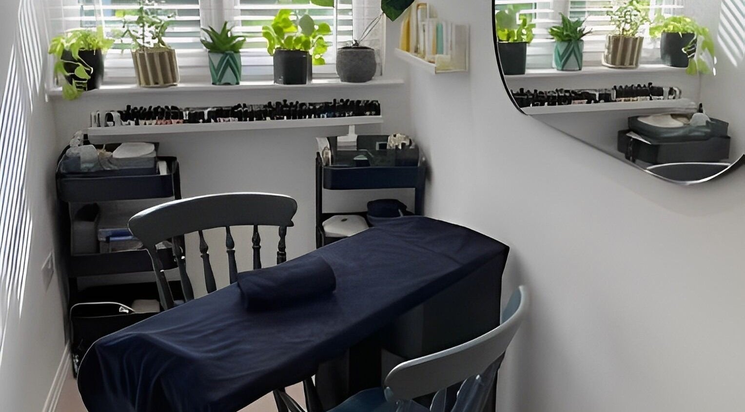 Tranquil treatment room at Rare Beauty by Adele in Farsley, England, GB with elegant decor and lush plants.