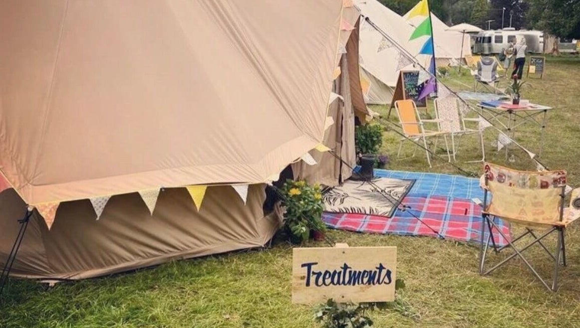 Latitude Luxury tent setup for wellness treatments in Southwold, England, GB. Cozy outdoor relaxation area.