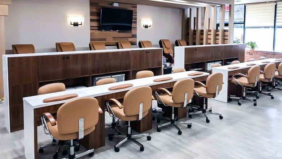 Modern nail salon interior at Sage Nail & Spa, Poughkeepsie, New York, US with elegant seating and decor.