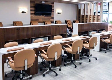 Modern nail salon interior at Sage Nail & Spa, Poughkeepsie, New York, US with elegant seating and decor.