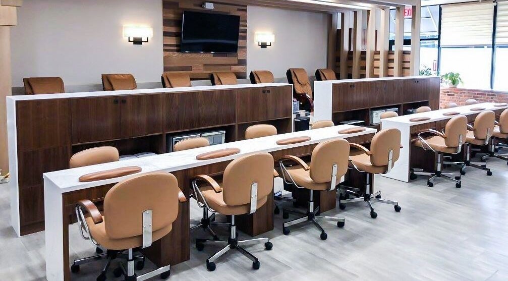 Modern nail salon interior at Sage Nail & Spa, Poughkeepsie, New York, US with elegant seating and decor.