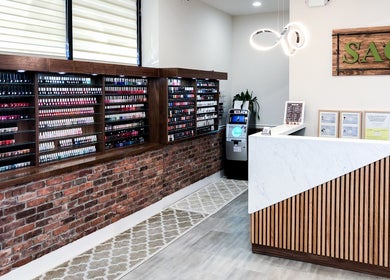 Chic interior of Sage Nail & Spa in Poughkeepsie, New York, US with elegant nail polish displays and modern decor.