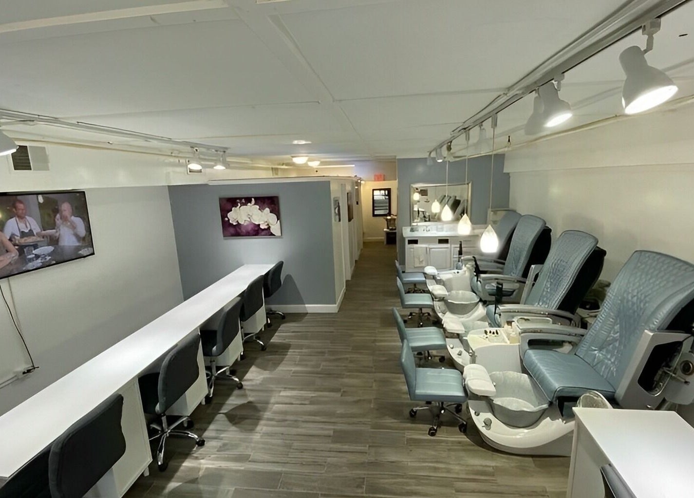 Sofia Nails & Spa in Newton, Massachusetts, US with chic pedicure chairs and a modern manicure area.