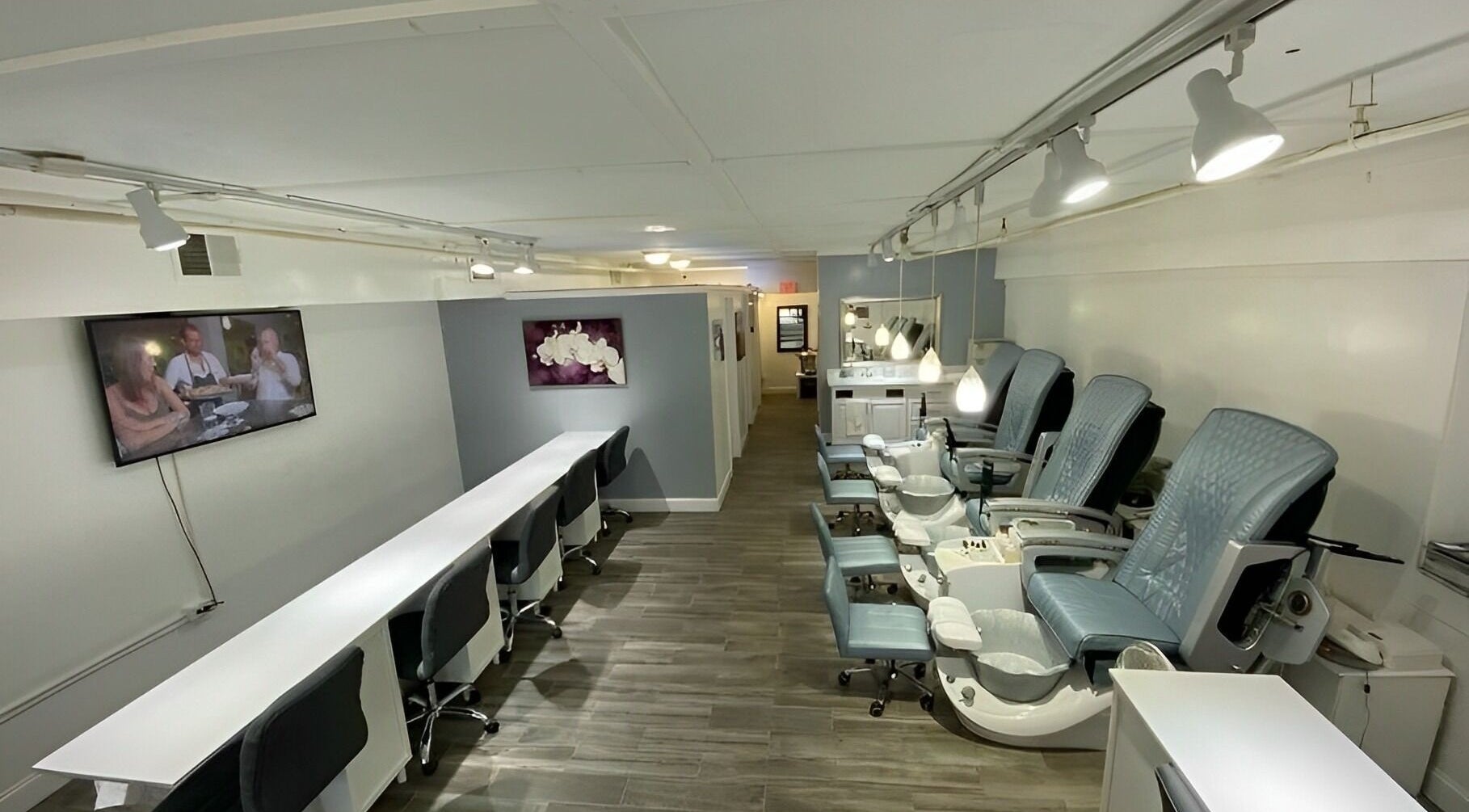 Sofia Nails & Spa in Newton, Massachusetts, US with chic pedicure chairs and a modern manicure area.