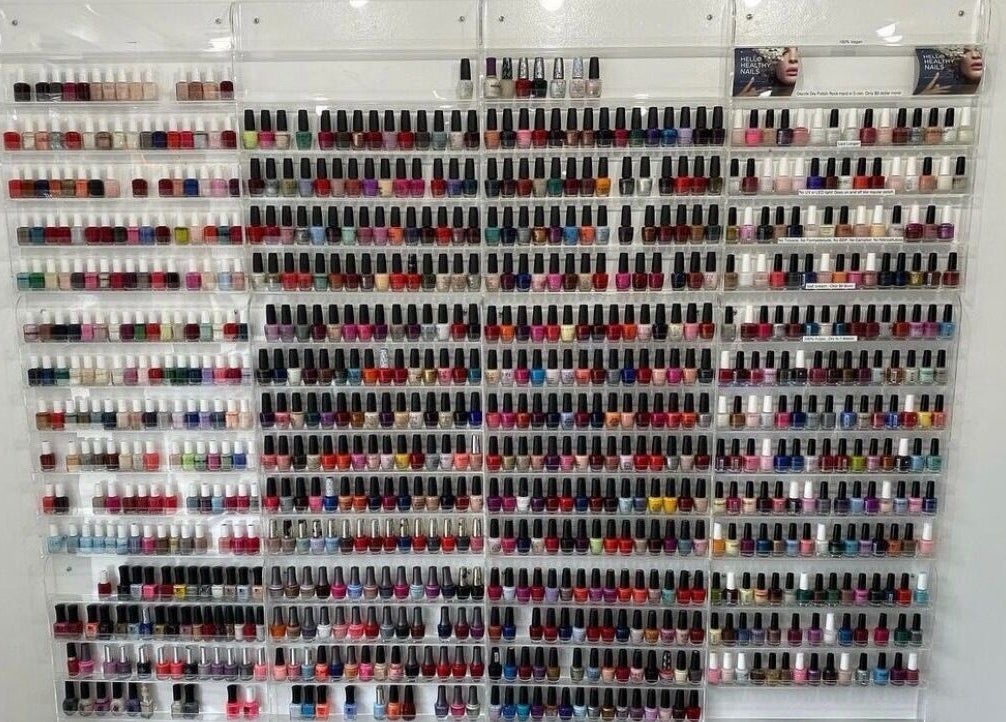 Vibrant nail polish display at Sofia Nails & Spa, Newton, Massachusetts, US, showcasing diverse colors.