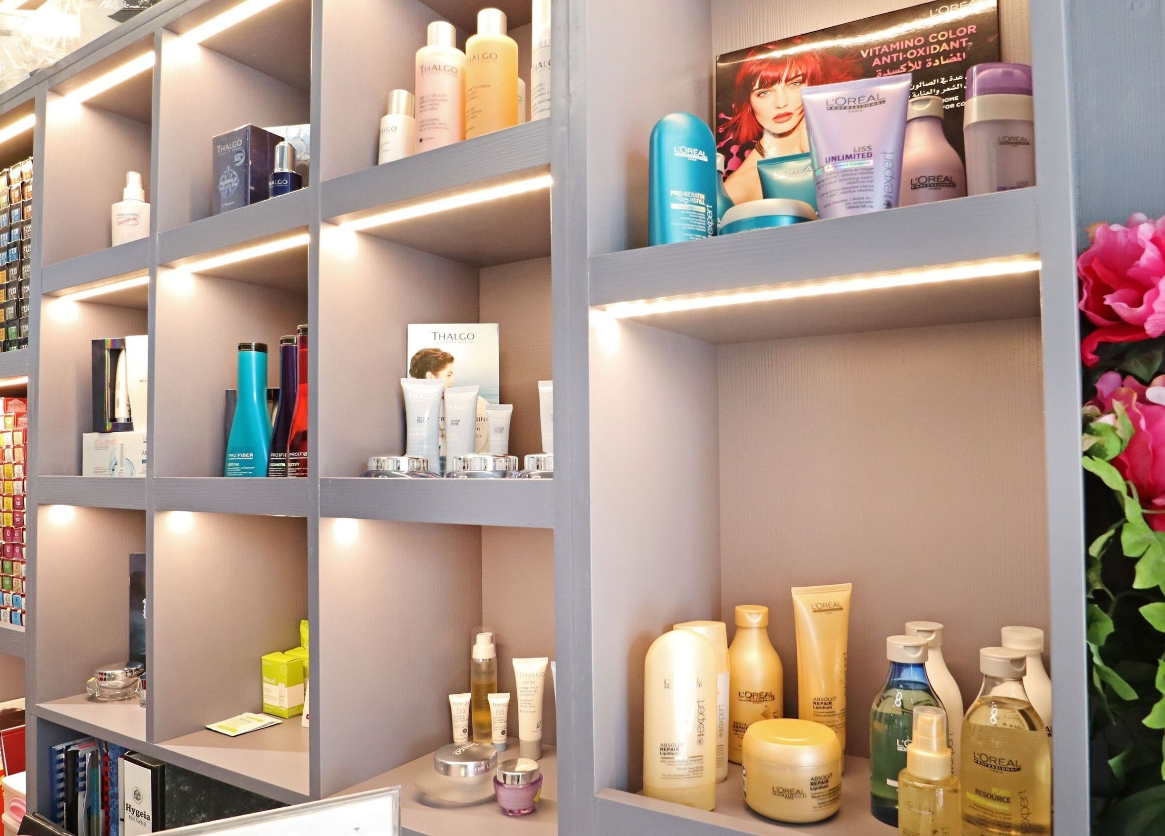 Elegant shelves displaying beauty products at Mastercuts UAE, Dubai, Dubai, AE, showcasing a vibrant assortment.