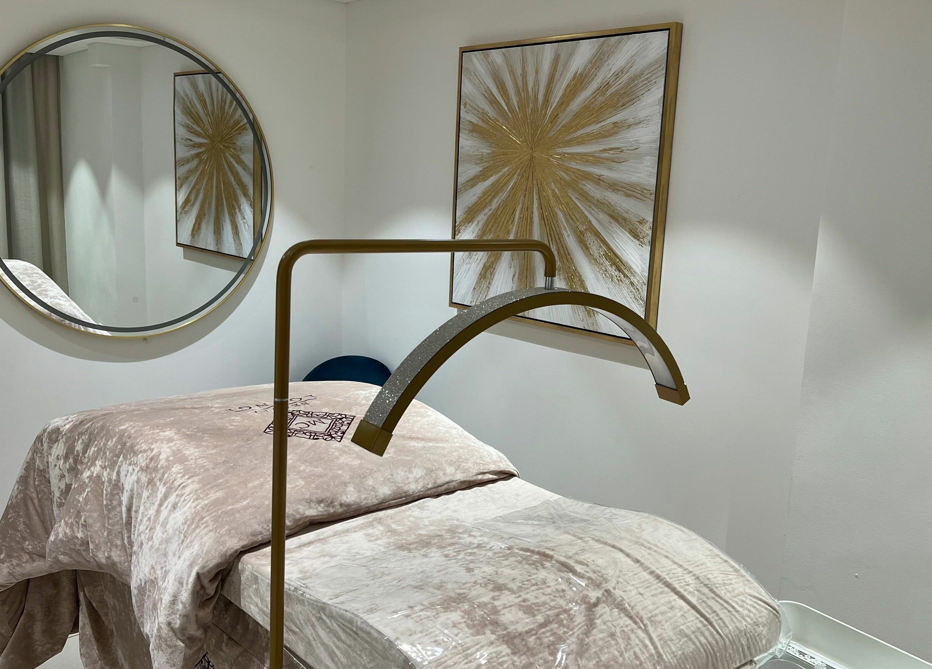 Relaxing treatment room at MC Beauty Lounge, دبي, دبي, AE, featuring a plush bed and elegant decor.