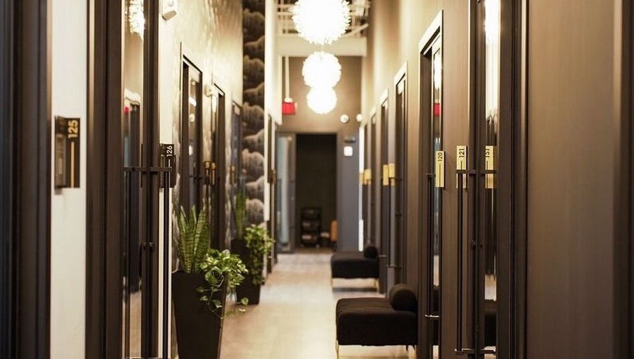 Stylish hallway at Katie Image Studios #125 in Lee's Summit, Missouri, US with modern design and seating.