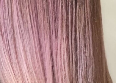 Long pink hair styled at Katie Image Studios #125 in Lee's Summit, Missouri, US, showcasing vibrant color techniques.