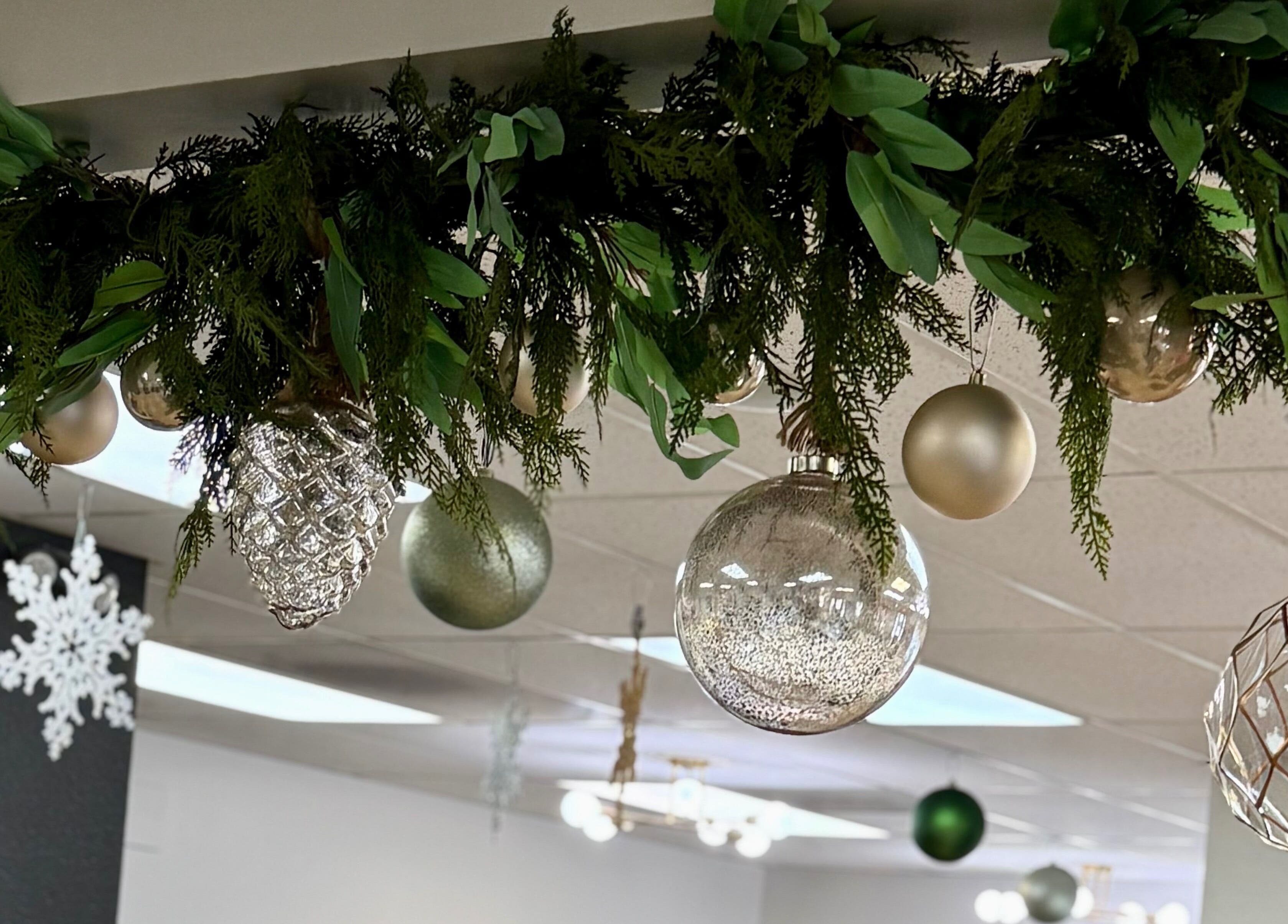 Chic holiday decor at Katie @ Salon Nuvo in Lee's Summit, Missouri, US, featuring lush greenery and shimmering ornaments.