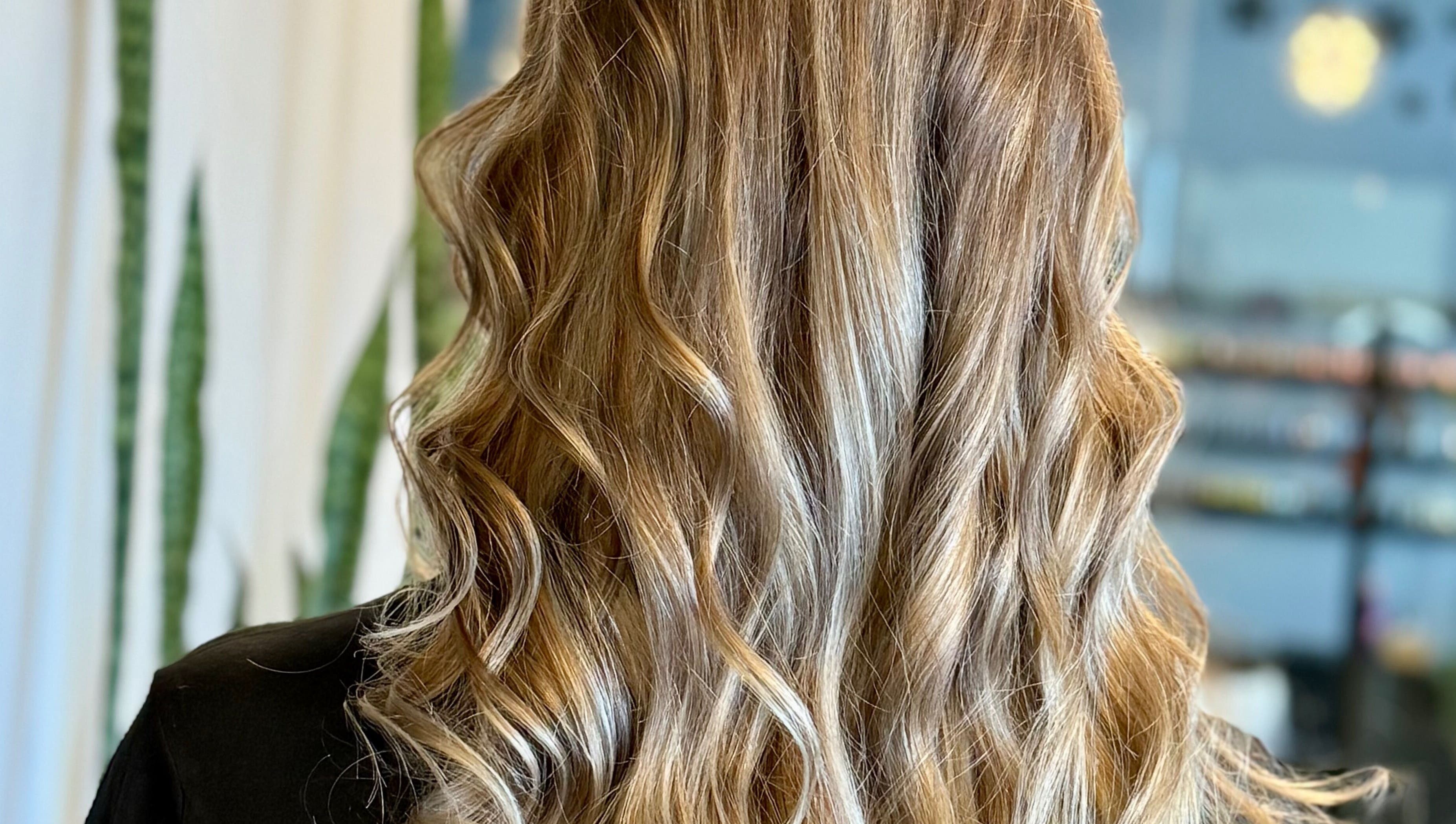 Elegant wavy hairstyle by Katie at Salon Nuvo in Lee’s Summit, Missouri, US.