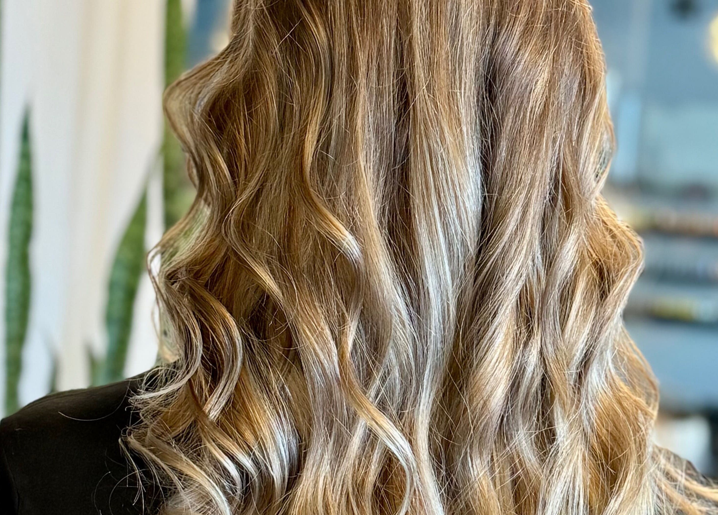 Elegant wavy hairstyle by Katie at Salon Nuvo in Lee’s Summit, Missouri, US.