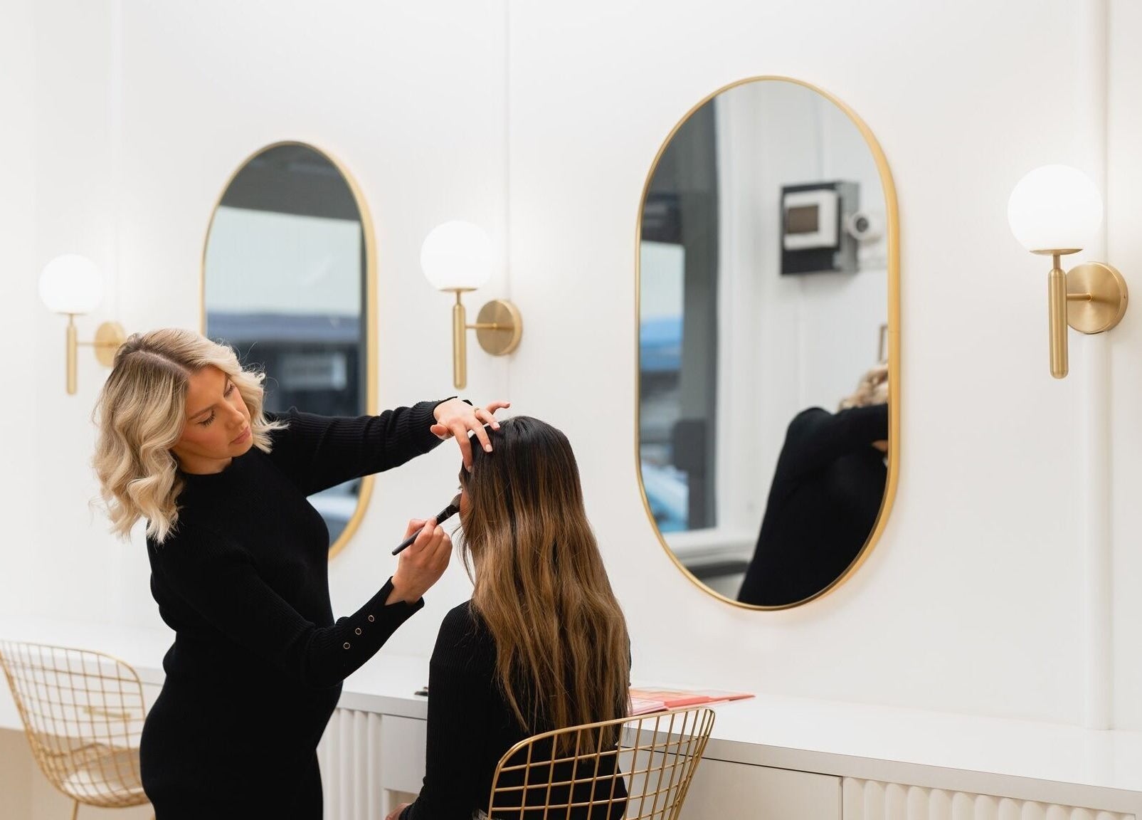 Makeup artist styling at The Glow Lab, Wagga Wagga, New South Wales, AU, in modern, elegant environment.