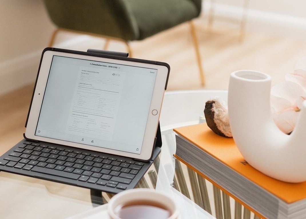 A tranquil workspace at The Glow Lab, Wagga Wagga, New South Wales, AU, featuring a tablet and elegant decor.