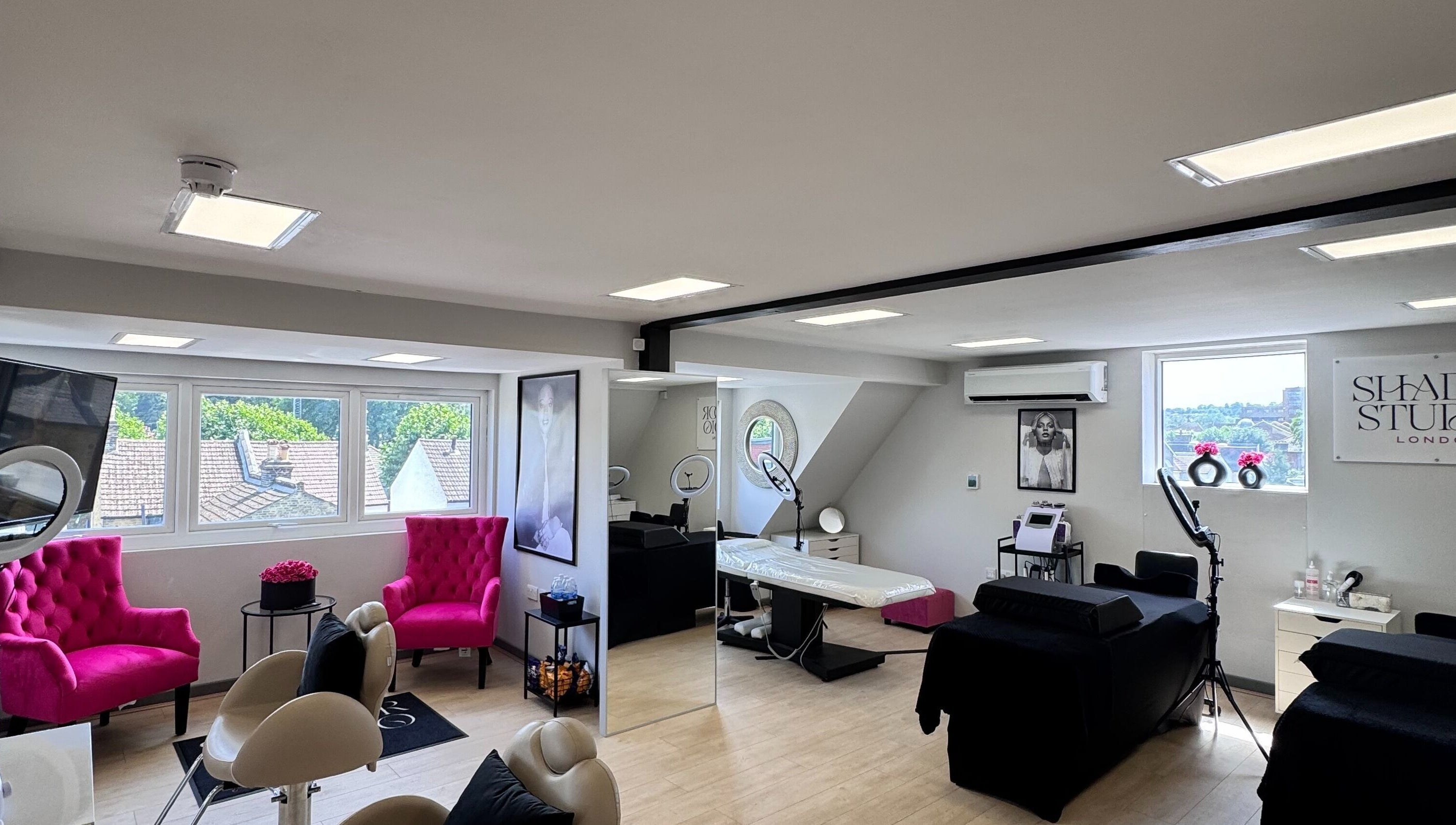 Beautiful interior of Shador Studio London in South Croydon, England, GB, featuring stylish decor and pink chairs.