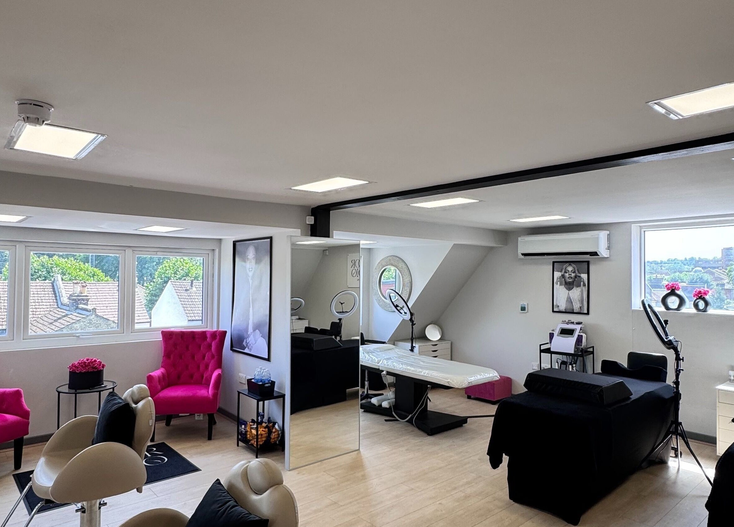 Beautiful interior of Shador Studio London in South Croydon, England, GB, featuring stylish decor and pink chairs.