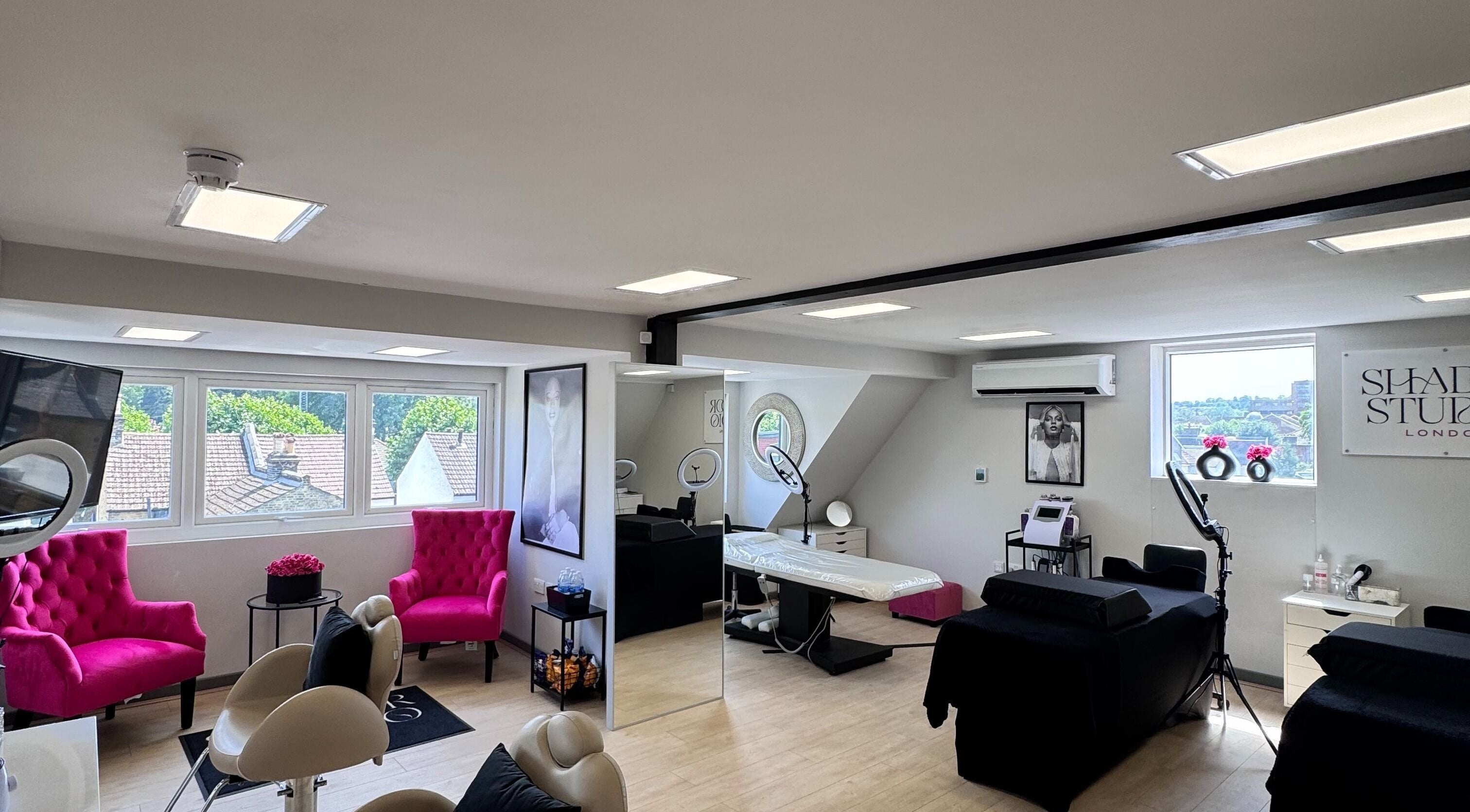 Beautiful interior of Shador Studio London in South Croydon, England, GB, featuring stylish decor and pink chairs.
