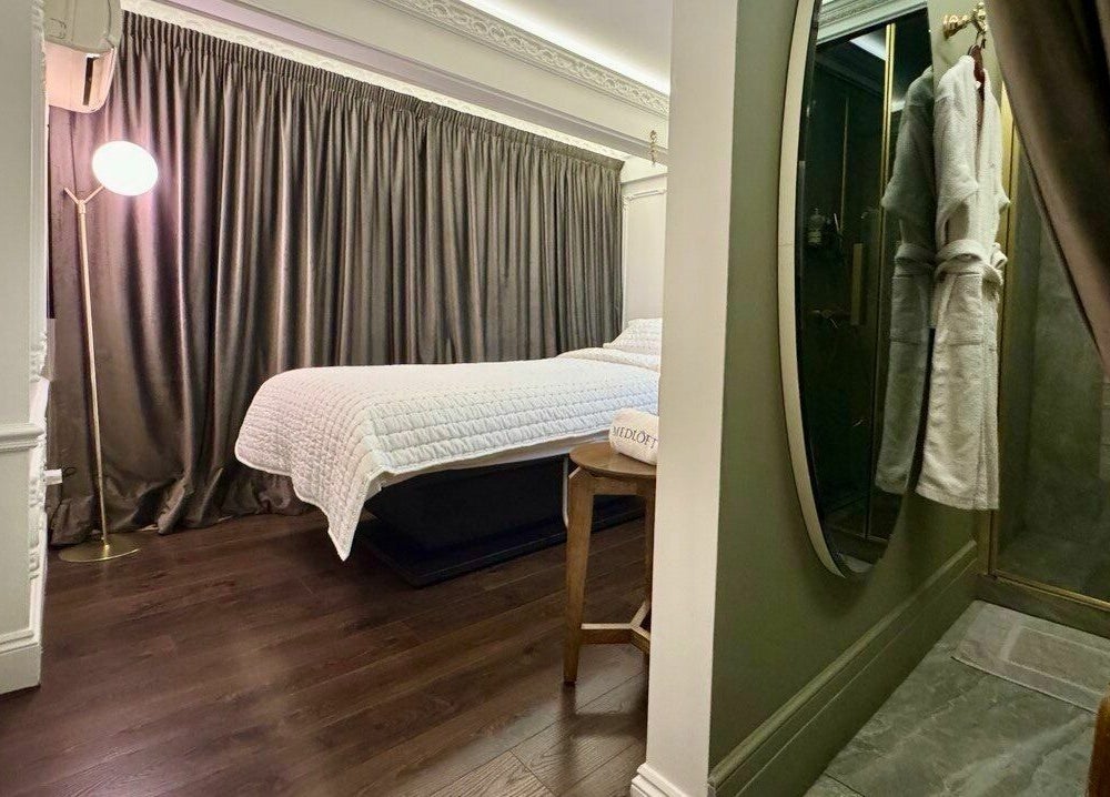 Elegant treatment room at Medloft Beauty Couture, Limassol, CY, featuring plush decor and ambient lighting.