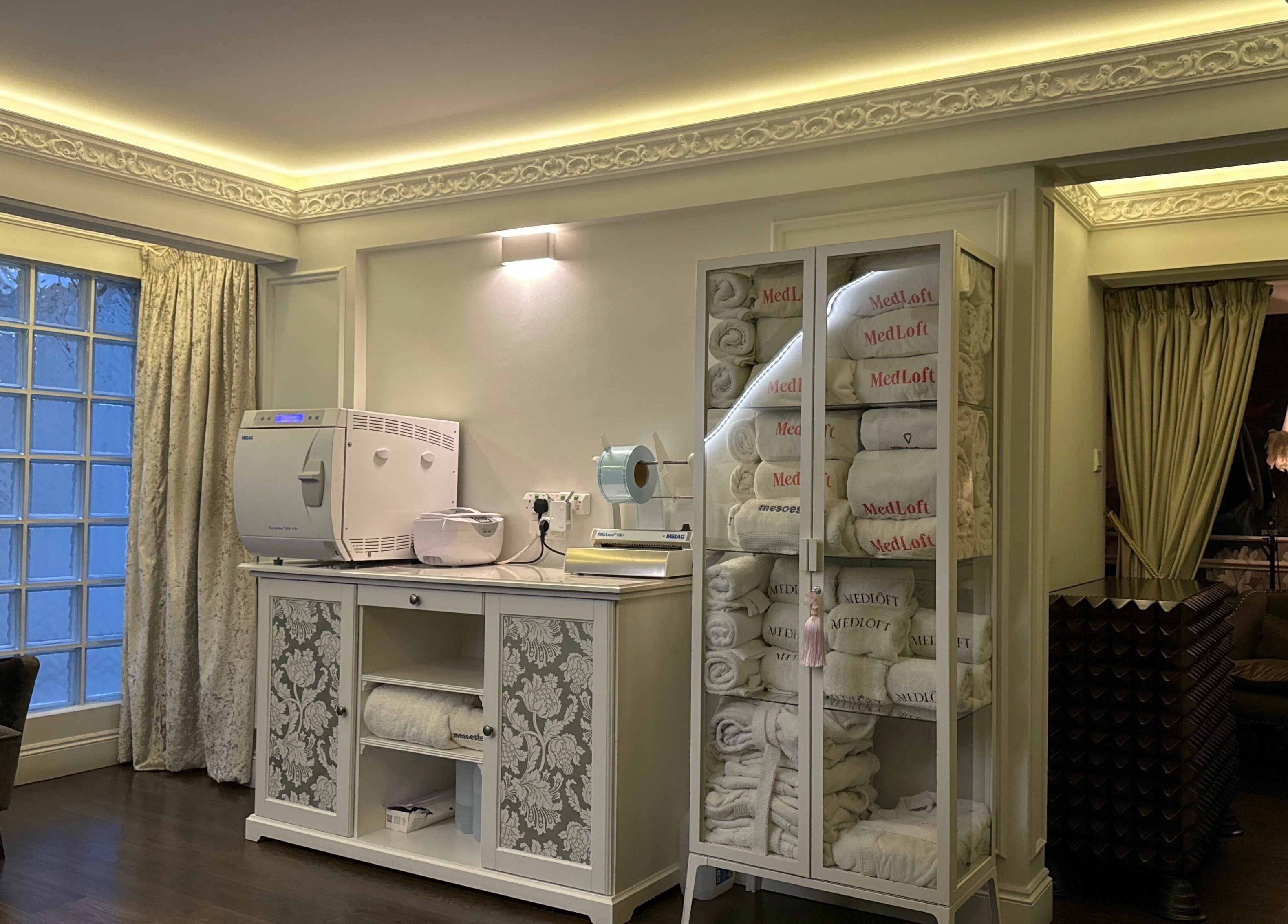 Luxurious treatment room at Medloft Beauty Couture, Limassol, CY, featuring plush seating and elegant decor.