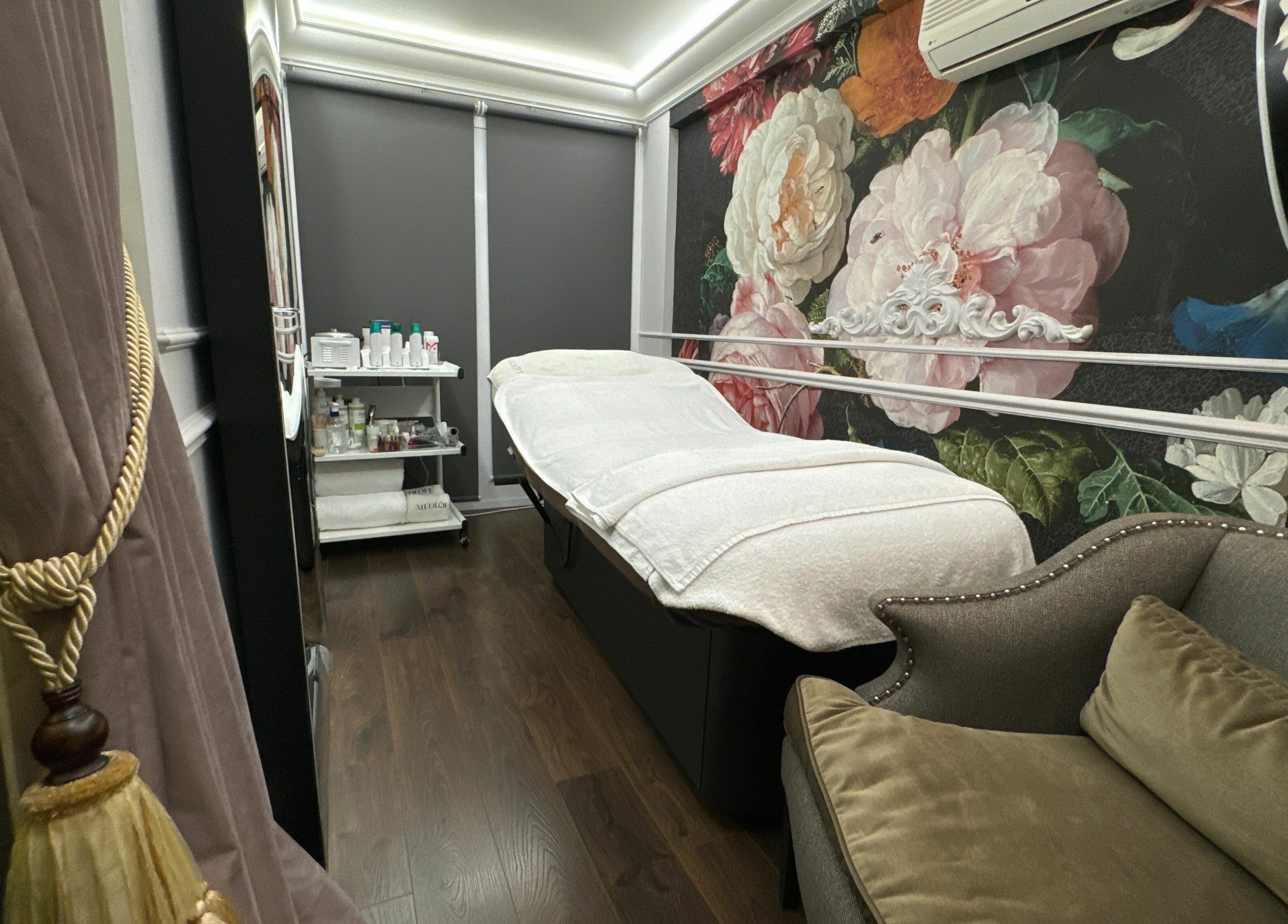 Elegant treatment room at Medloft Beauty Couture in Limassol, Limassol, CY, featuring floral decor and plush seating.