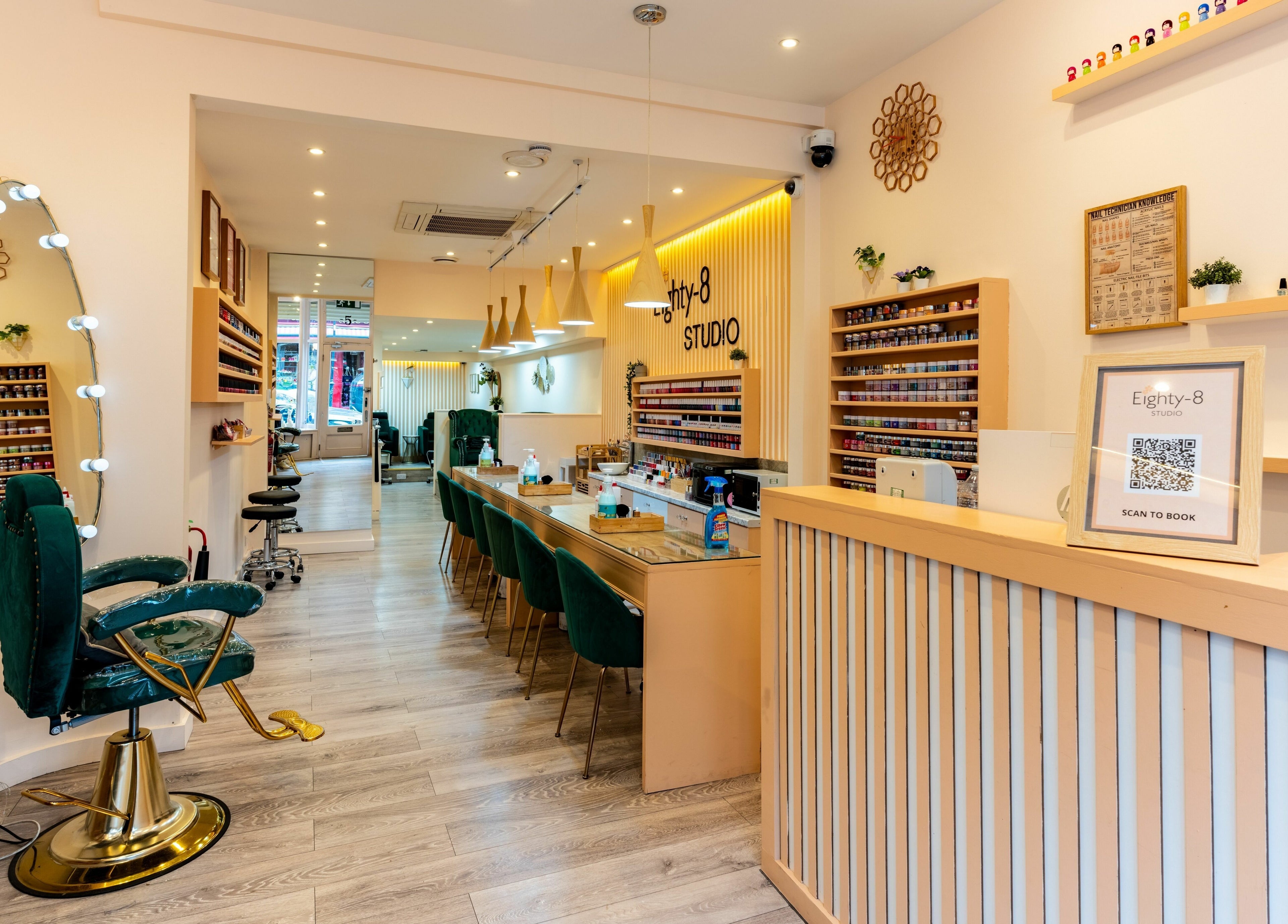 Modern interior of Eighty-8 Notting Hill, London, England, GB showcasing elegant nail bar and vibrant decor.