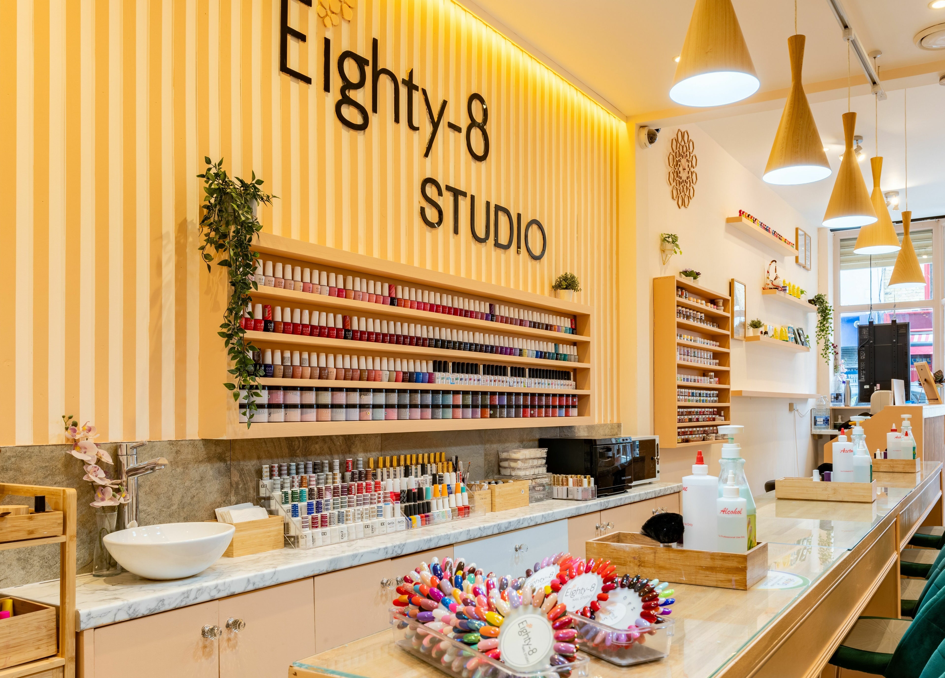 Eighty-8 Notting Hill in London, England, GB offers a chic beauty space with nail polish displays and modern decor.