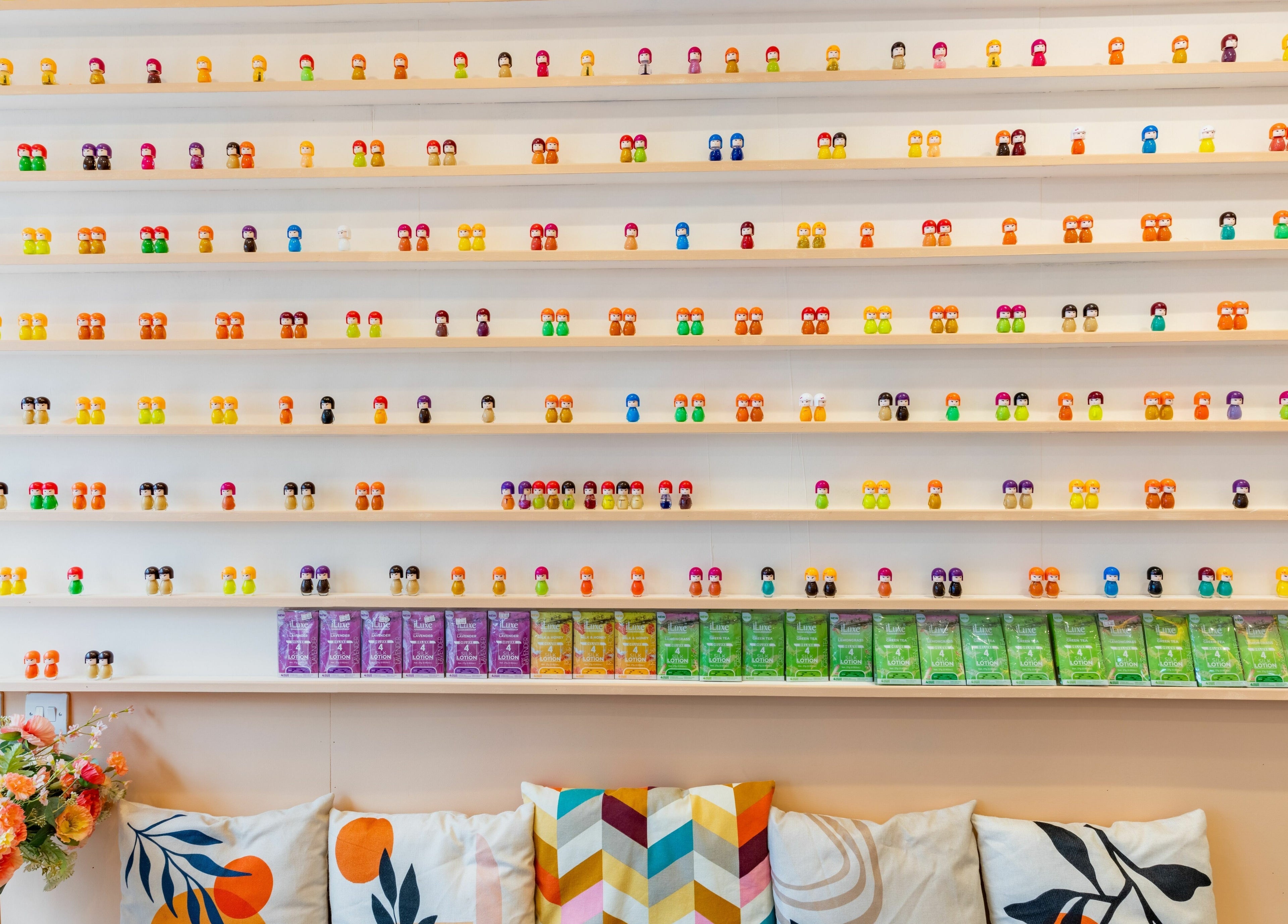 Decorative shelves with colorful items at Eighty-8 Notting Hill, London, England, GB. Vibrant and inviting vibe.