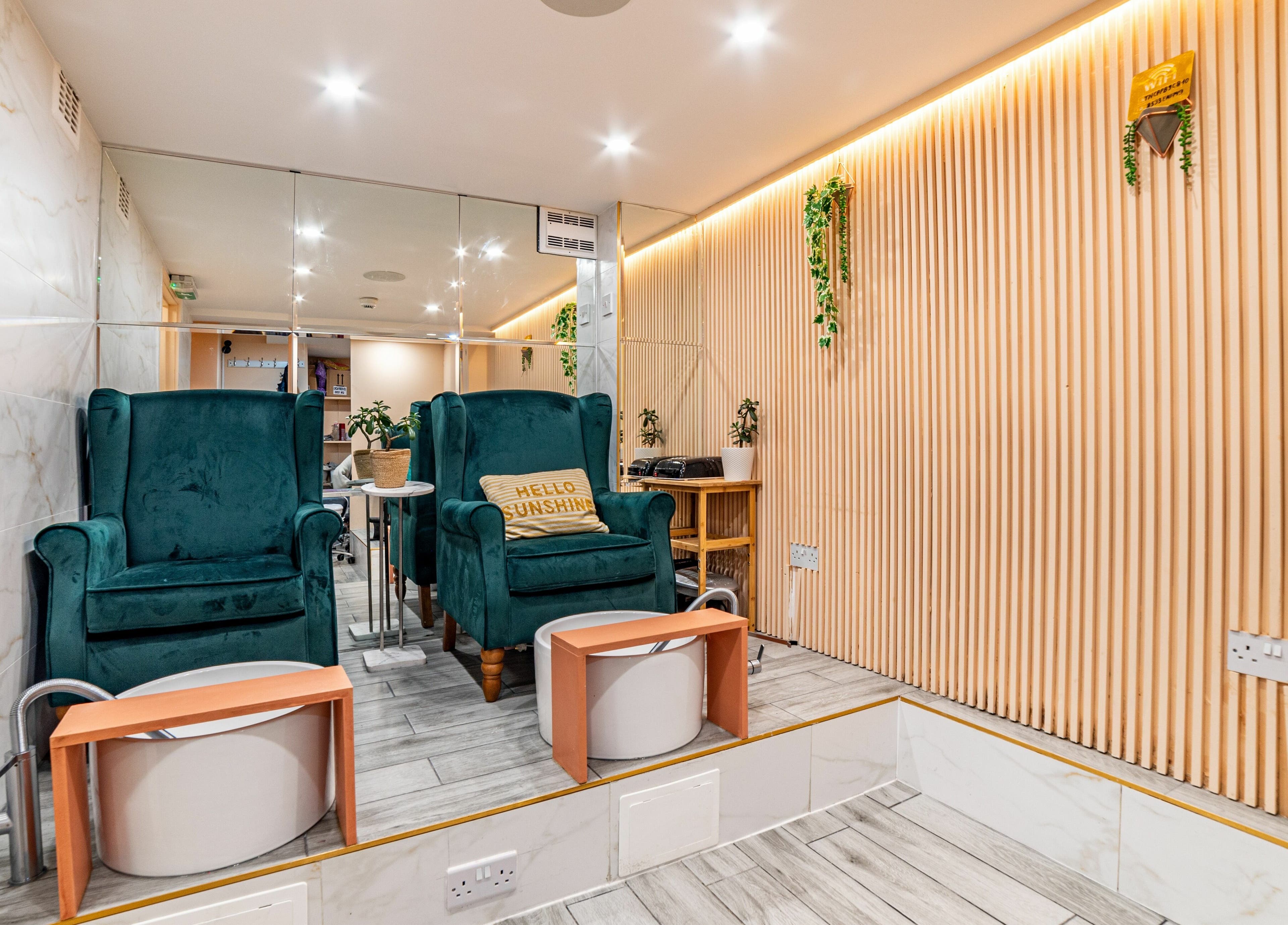 Elegant seating area at Eighty-8 Cale Street, London, England, GB with plush chairs and wooden accents.