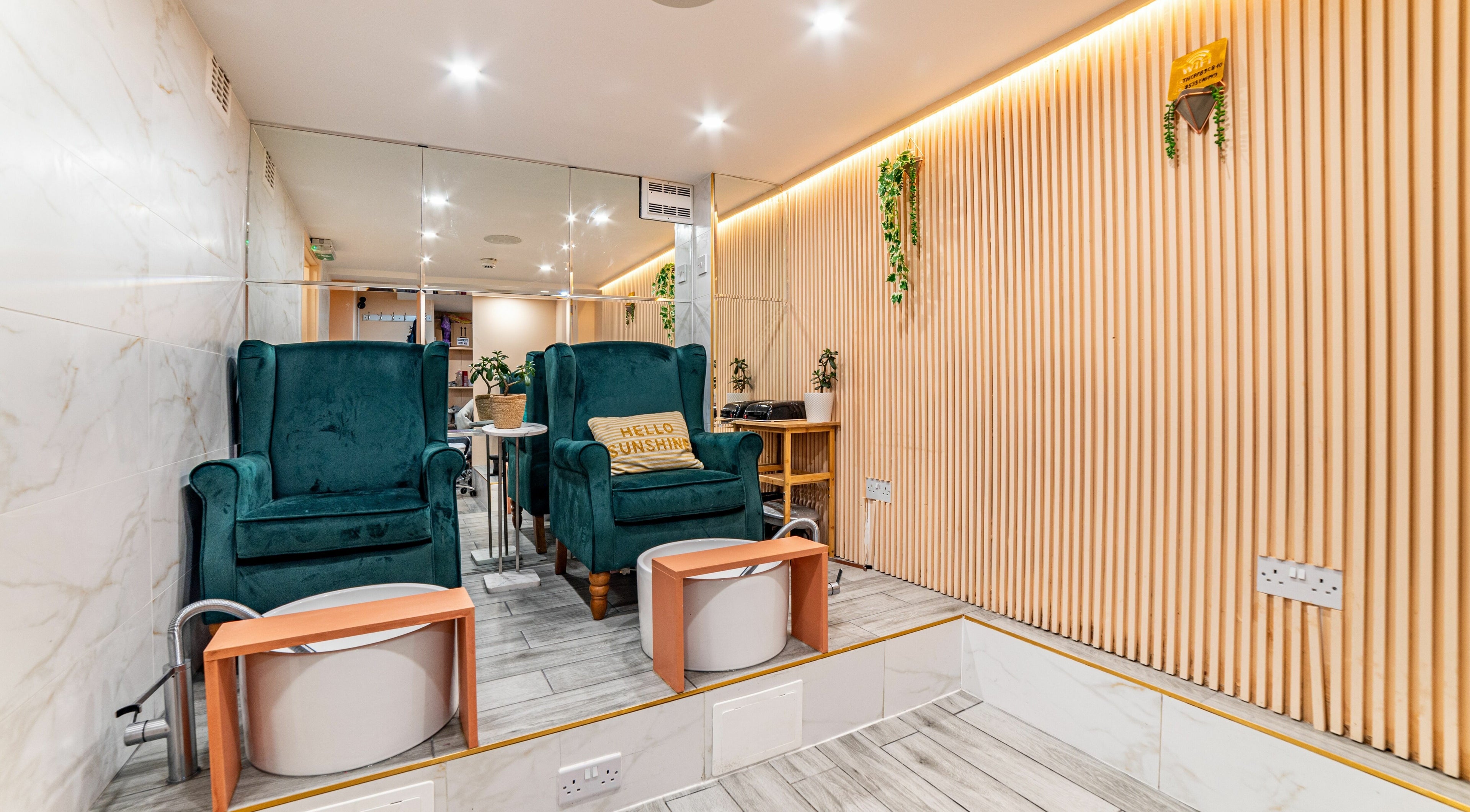 Elegant seating area at Eighty-8 Cale Street, London, England, GB with plush chairs and wooden accents.