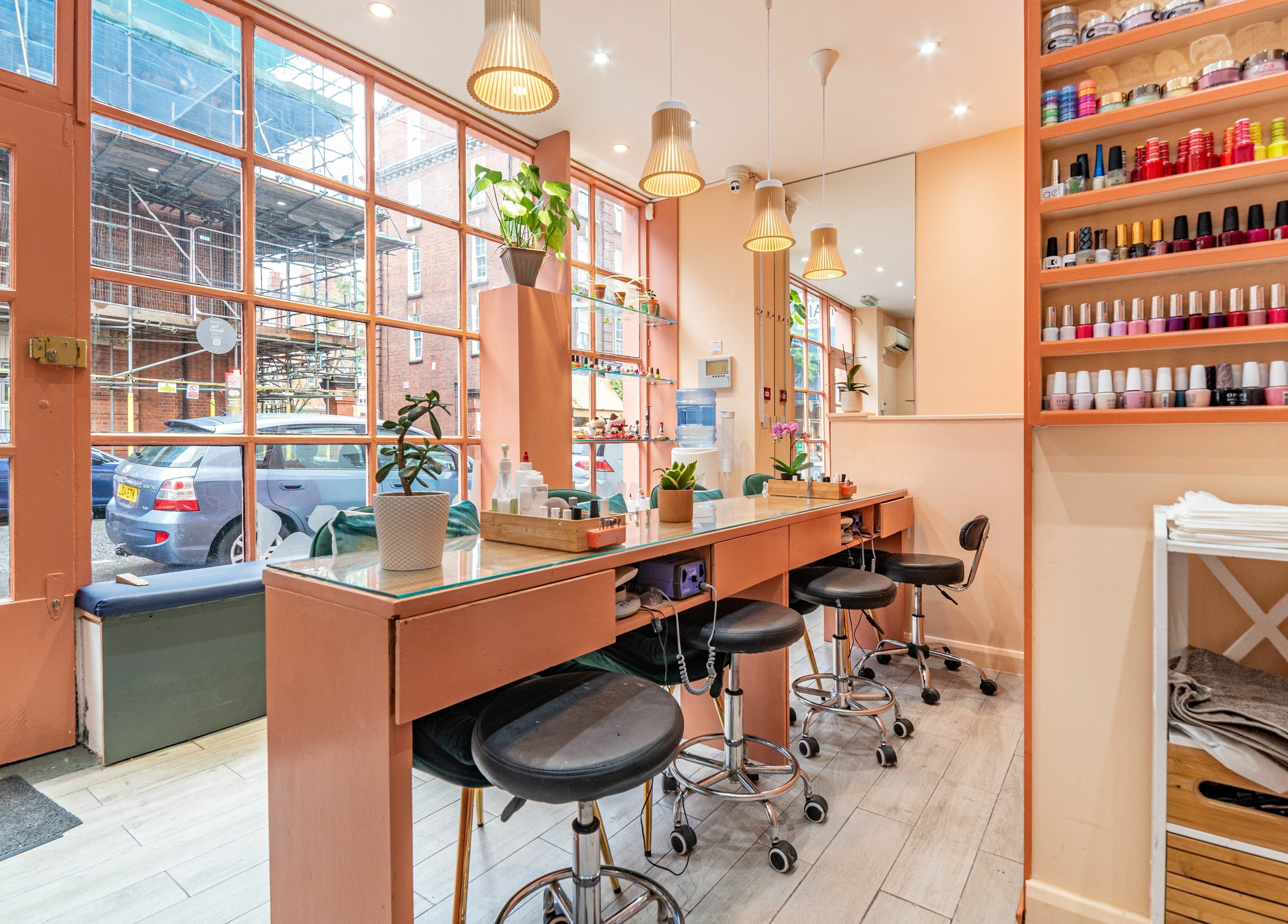 Interior of Eighty-8 Cale Street nail salon in London, England, GB featuring stylish design and polish display.