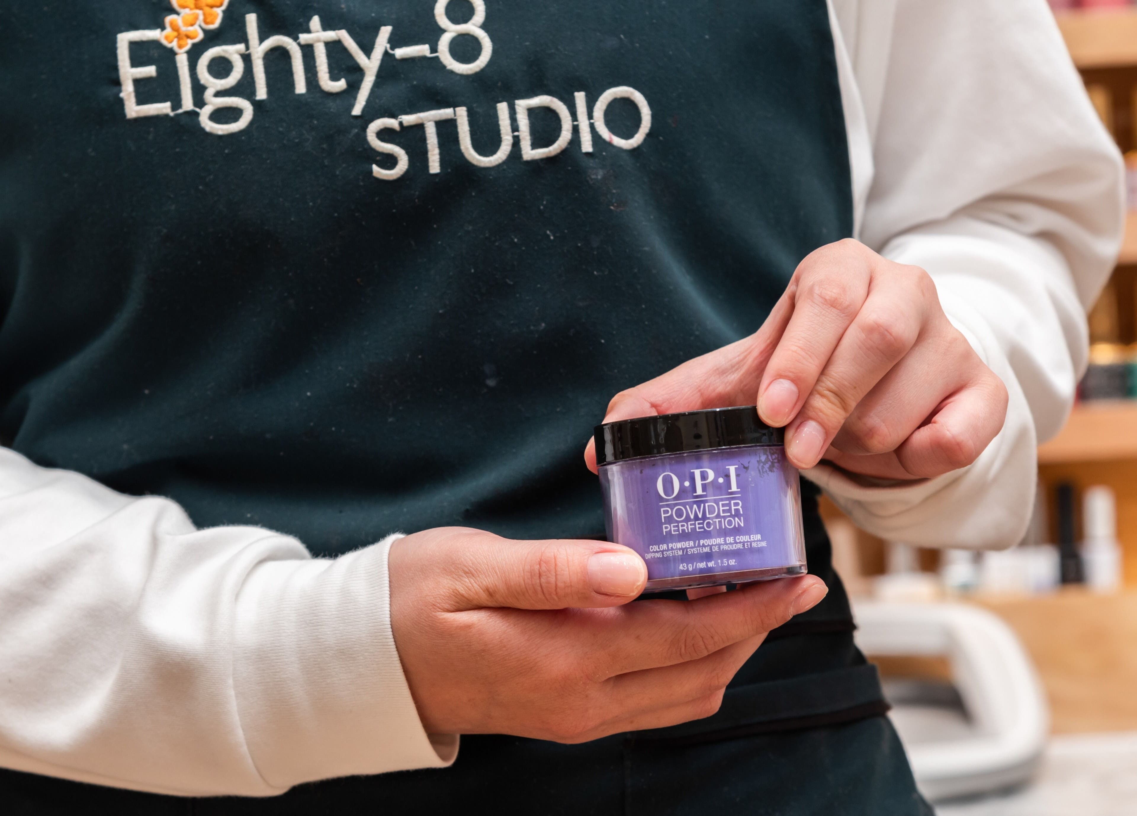 Eighty-8 Covent Garden staff holding OPI product, London, England, GB.