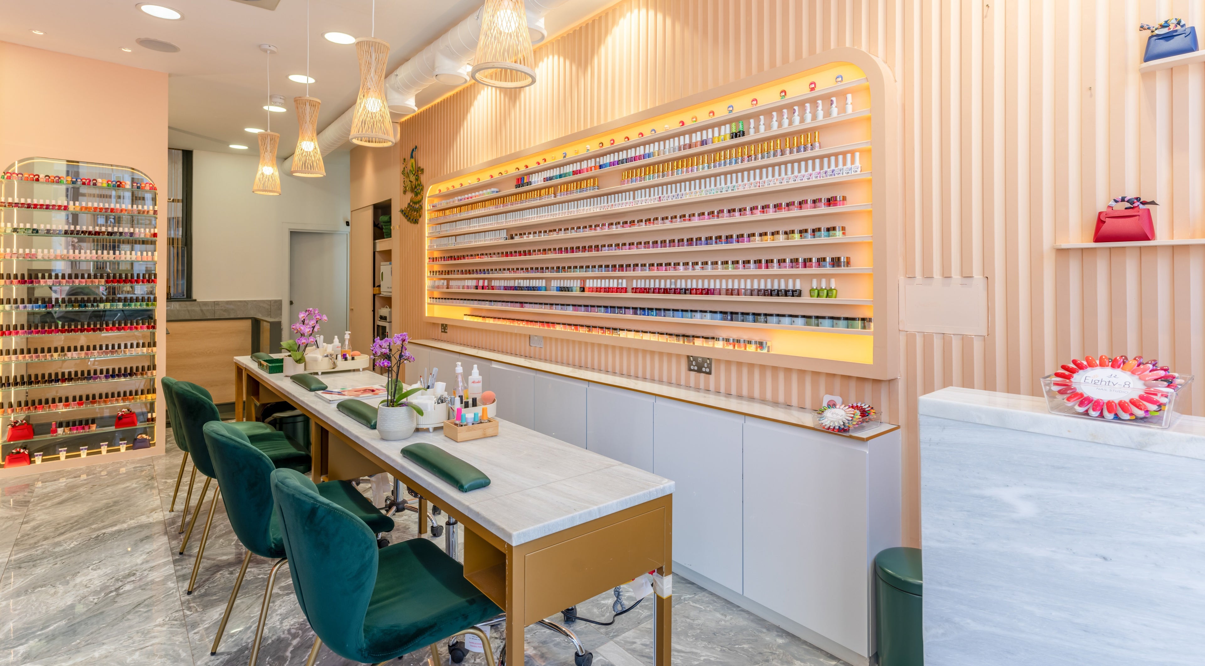 Stylish nail bar interior at Eighty-8 Kings Road in London, England, GB with sleek decor and vibrant polish display.