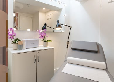 Tranquil beauty treatment room at Eighty-8 Kings Road, London, England, GB with plush chair and soft lighting.