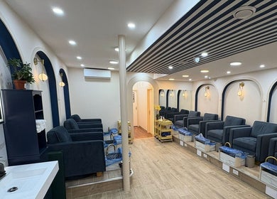Elegant seating at The Nail Town, a chic salon in London, England, GB with modern decor and plush chairs.
