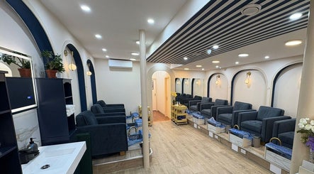 Elegant seating at The Nail Town, a chic salon in London, England, GB with modern decor and plush chairs.