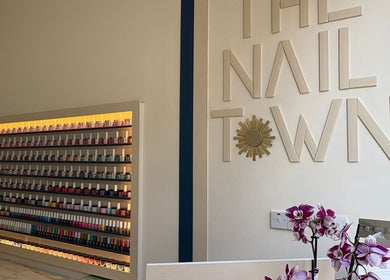 Interior of The Nail Town, London, England, GB, showcasing a colorful nail polish display and stylish design.
