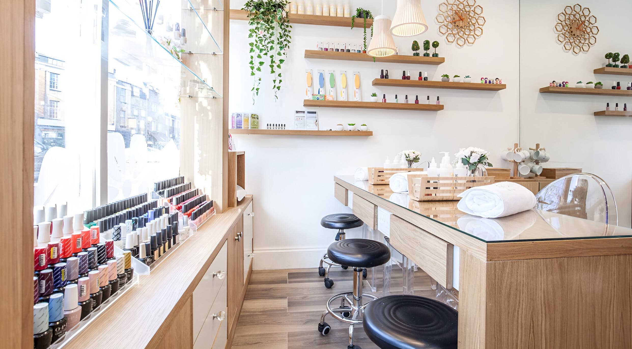 Bright, stylish nail bar at Eighty-8 Battersea, London, England, GB, showcasing an array of nail polishes.