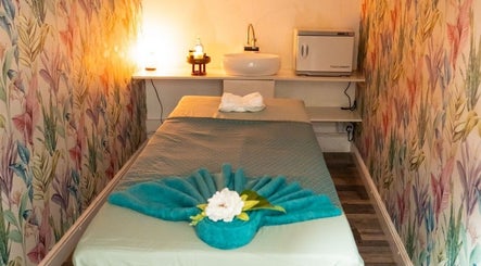Tranquil massage room at Gold Star Thai Massage, London, England, GB with calming decor and soft lighting.