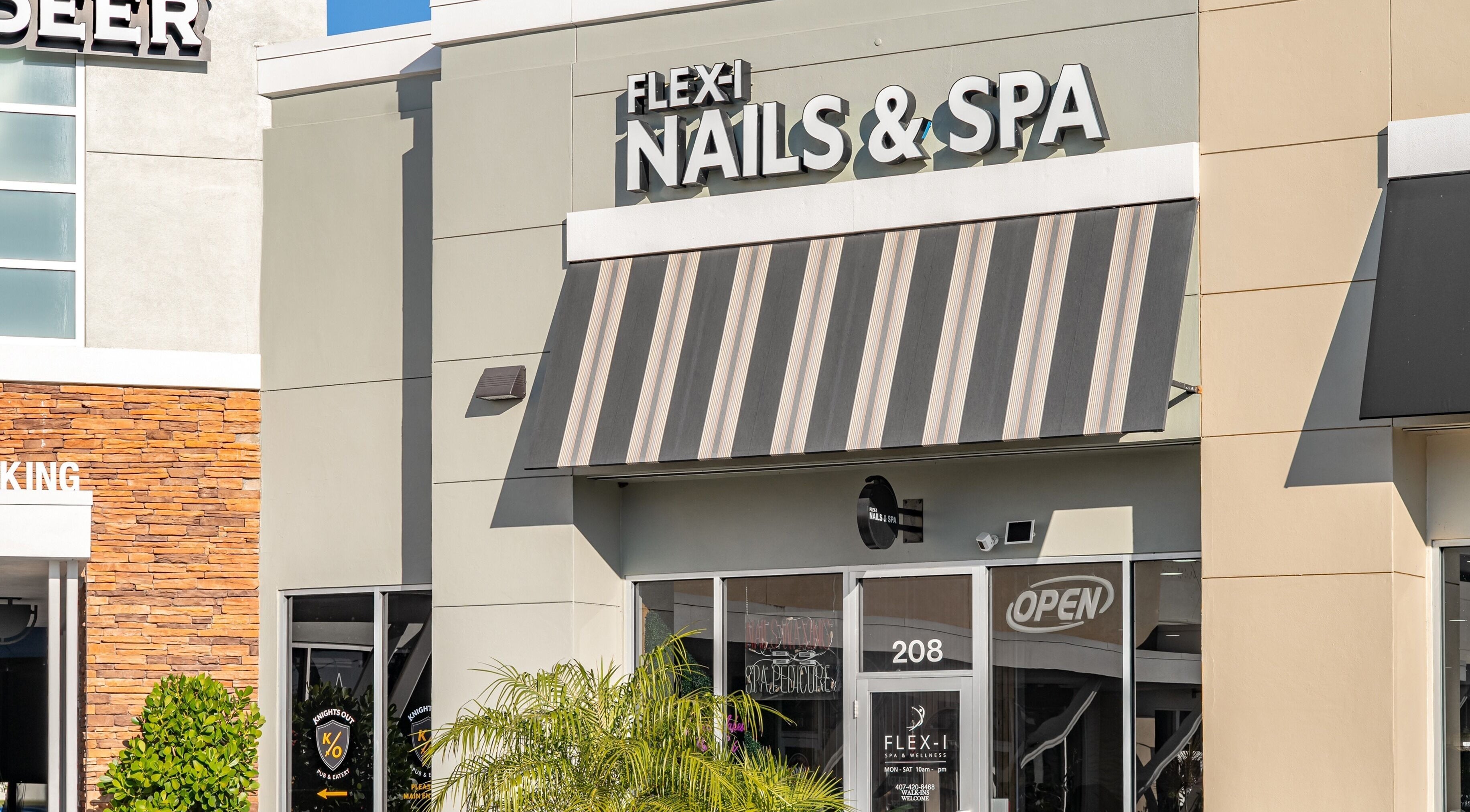 Front view of Flex-I Nails Spa located in Orlando, Florida, US, showcasing modern entrance and signage.
