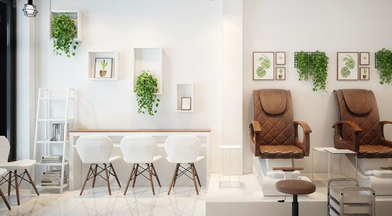 Stylish interior of Pearl Nail Bar College (534 College St) in Toronto, Ontario, CA with chic seating and decor.