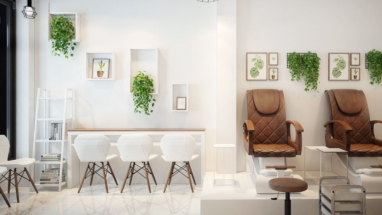 Stylish interior of Pearl Nail Bar College (534 College St) in Toronto, Ontario, CA with chic seating and decor.