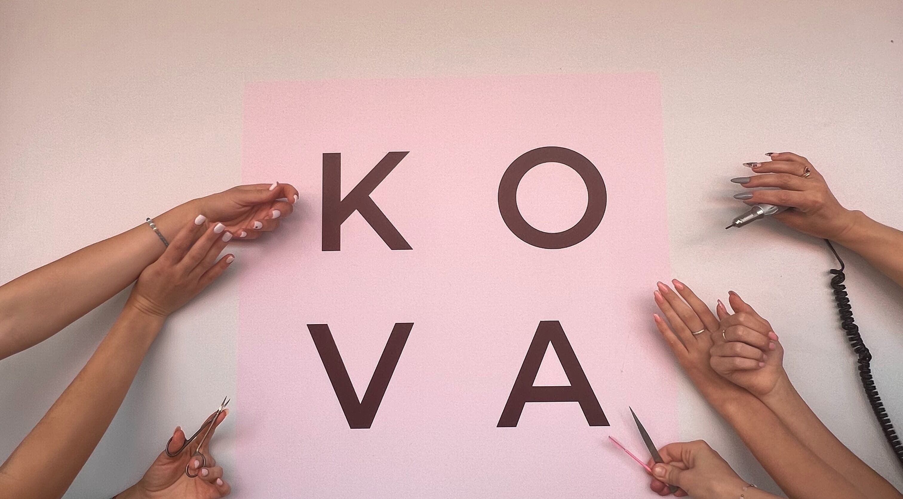 Hands with nail tools around the Kova Nails and Beauty logo in St Leonards, New South Wales, AU.