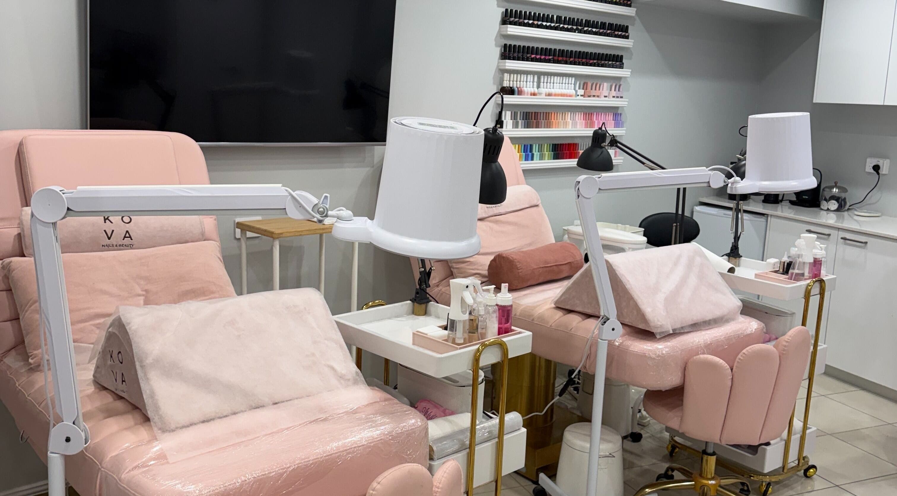 Elegant nail station at Kova Nails and Beauty, St Leonards, New South Wales, AU, showcasing pink decor and tools.