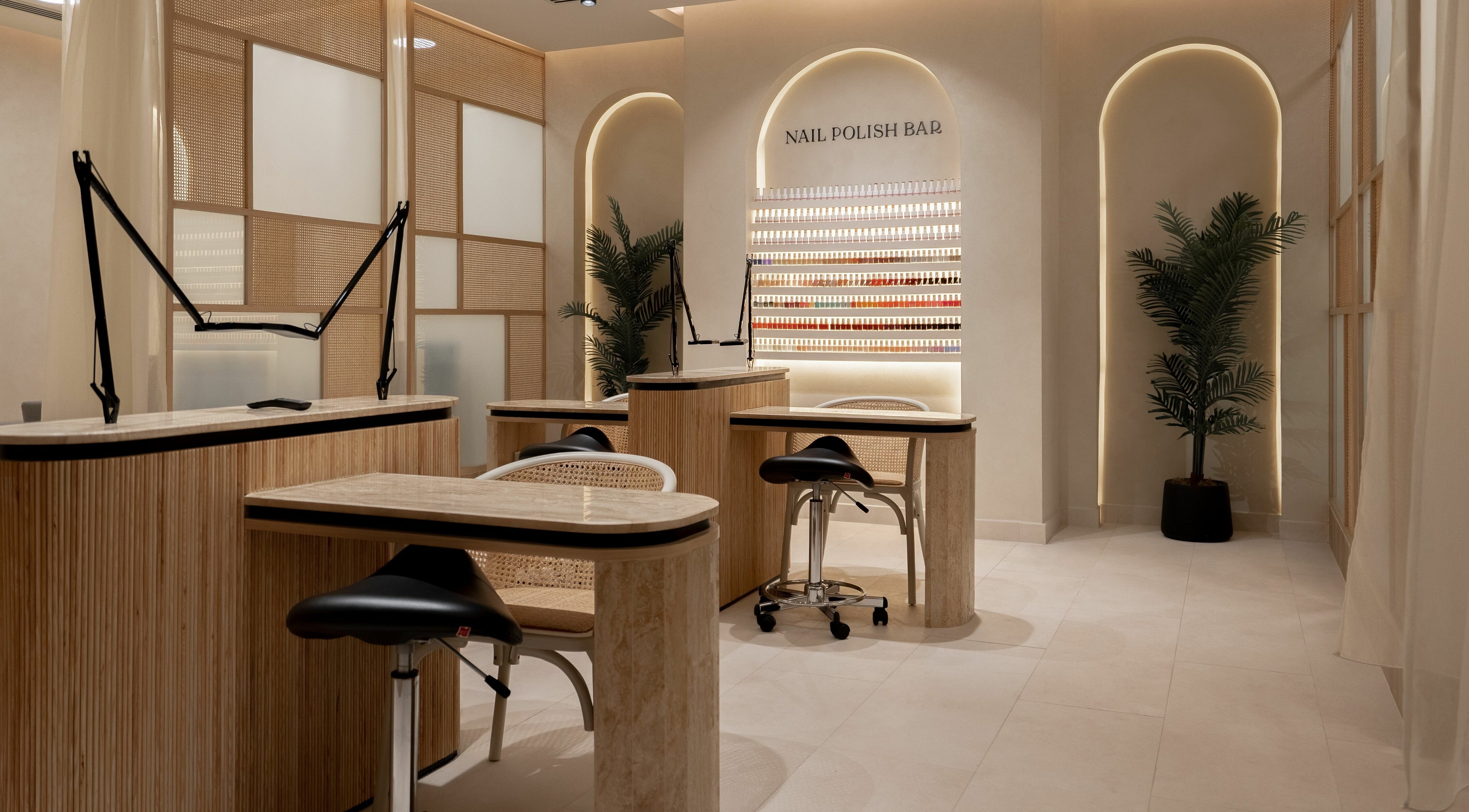 Elegant nail bar at Remedy Room, Abu Dhabi, Abu Dhabi, AE, with modern decor and nail polish display.