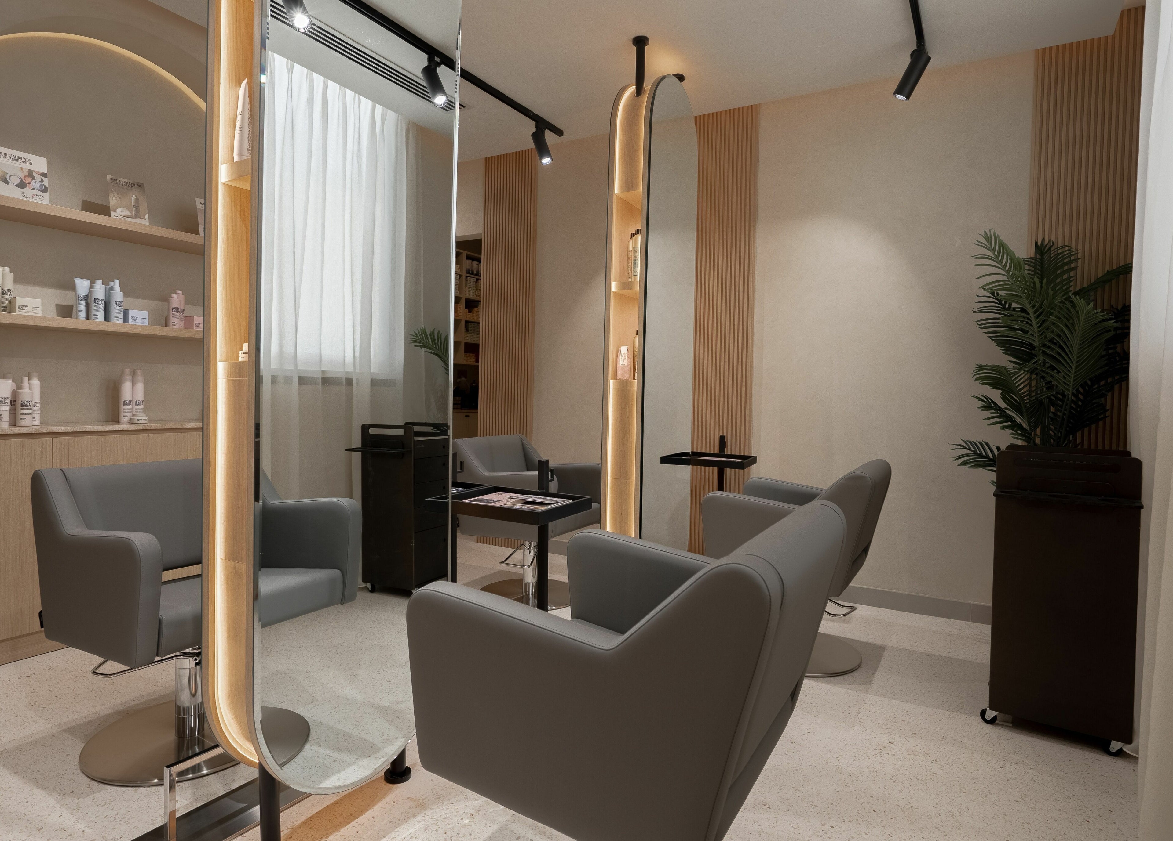 Chic salon chairs and mirror at Remedy Room, Abu Dhabi, Abu Dhabi, AE, offering a serene beauty experience.