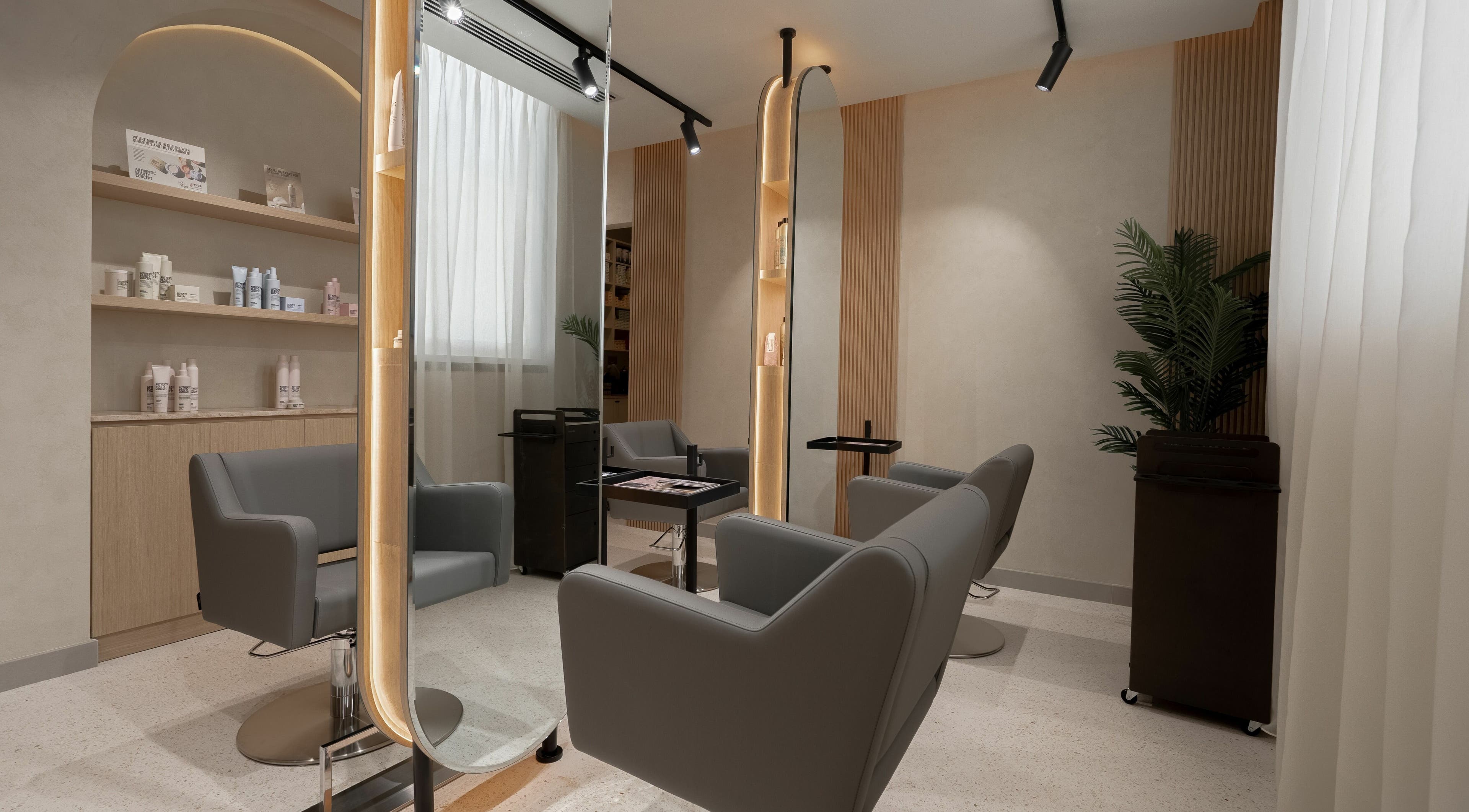 Chic salon chairs and mirror at Remedy Room, Abu Dhabi, Abu Dhabi, AE, offering a serene beauty experience.