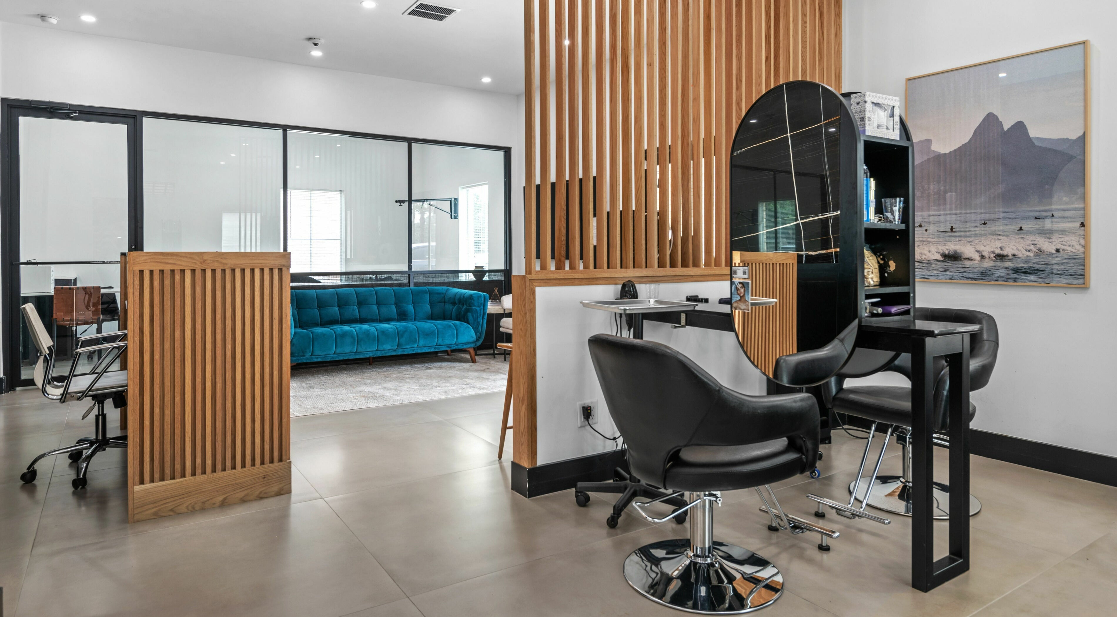 Modern interior of Mica Salon and Spa in Katy, Texas, US, featuring sleek chairs and elegant design elements.