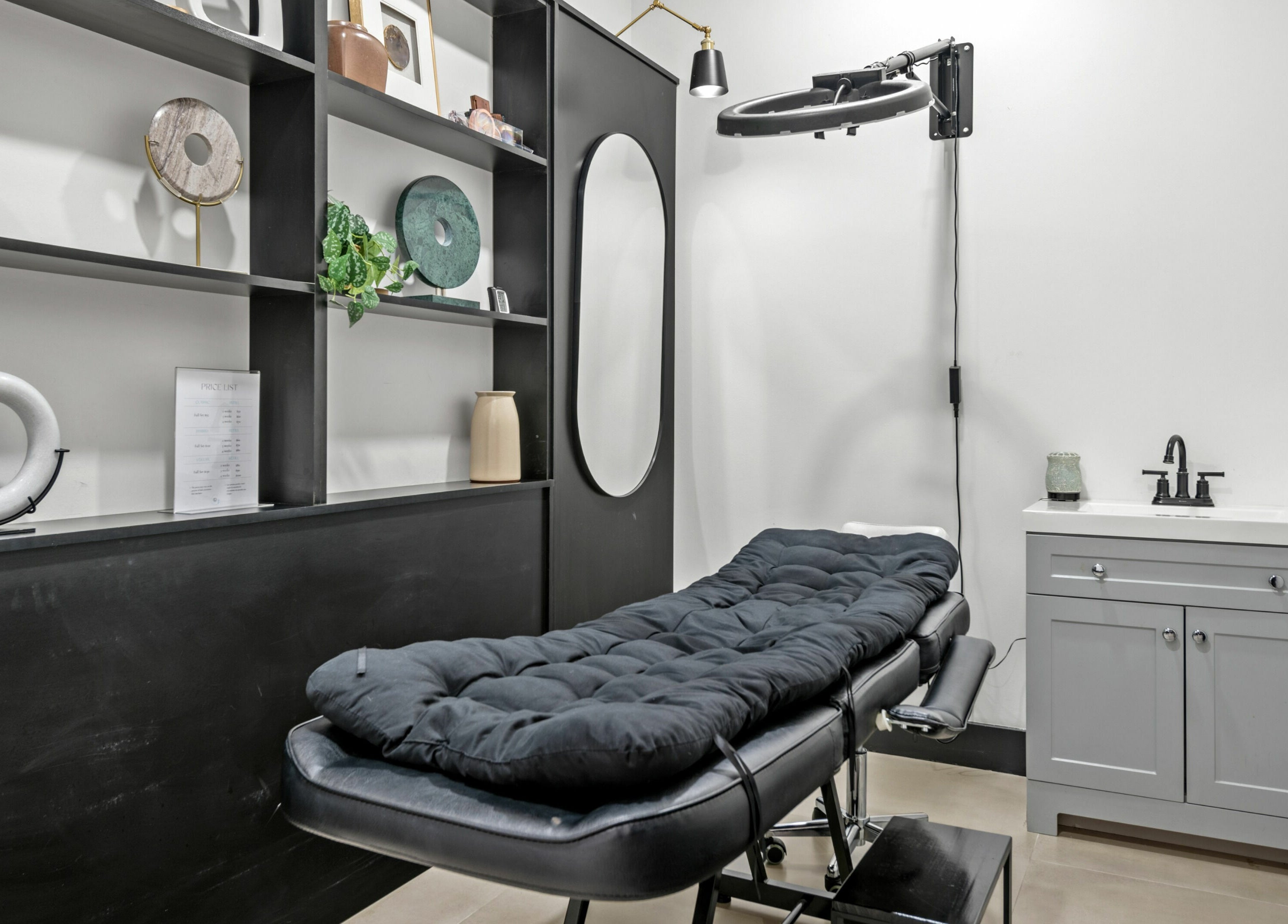 Elegant spa room at Mica Salon and Spa in Katy, Texas, US with a plush treatment bed and stylish decor.