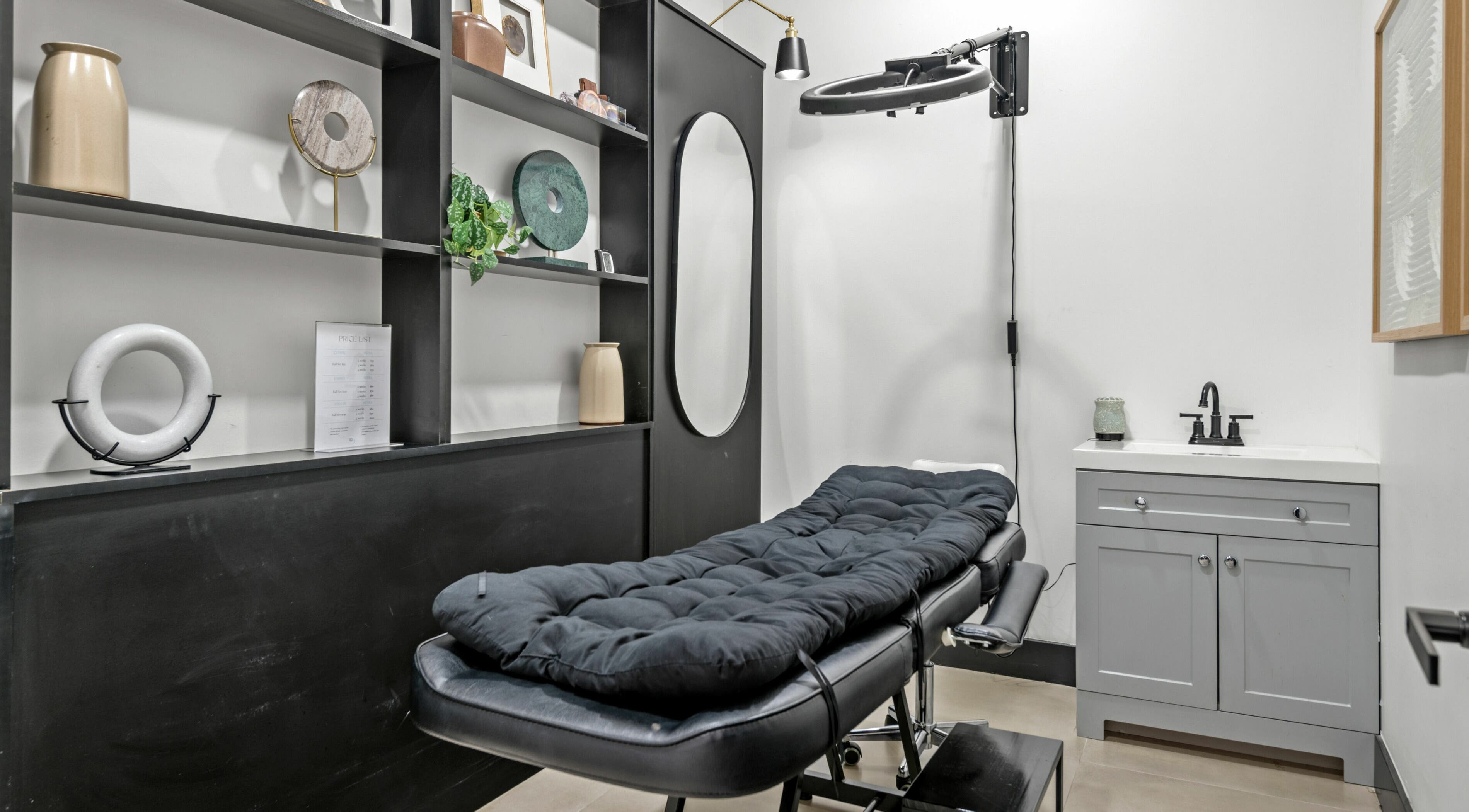 Elegant spa room at Mica Salon and Spa in Katy, Texas, US with a plush treatment bed and stylish decor.